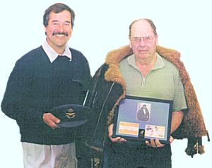 W/O J.R. Bristow meets Geoff Pringle of Oldnautibits. He is holding a frame containing a picture of him in 1943 together with a copy of his Goldfish Club membership certificate